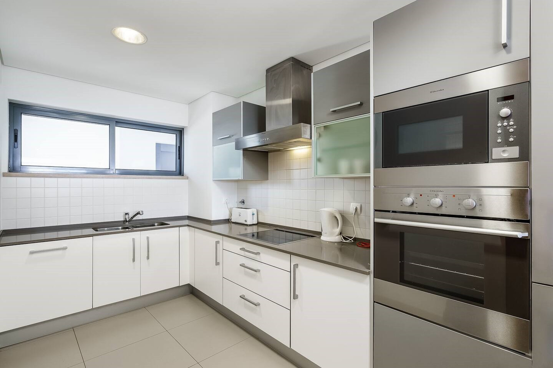 Modern white kitchen with appliances
