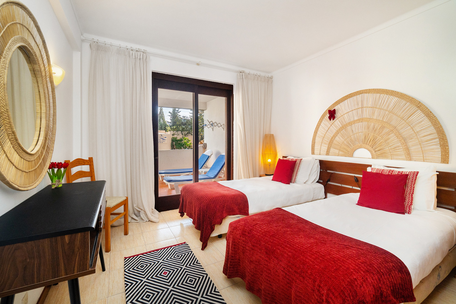 Bedroom 1 with 2 Single Beds and access to the Balcony