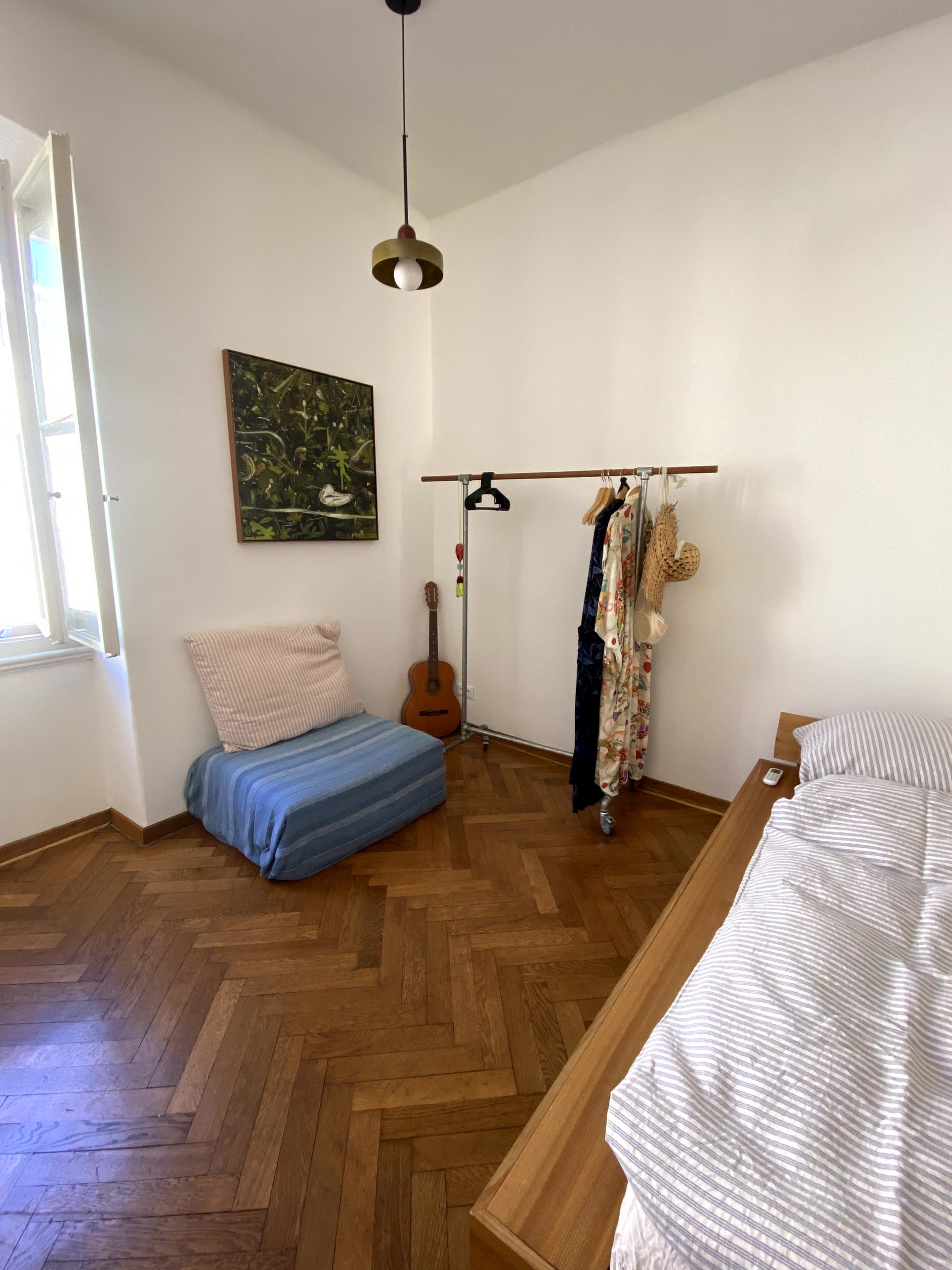 Bedroom corner with clothing rack