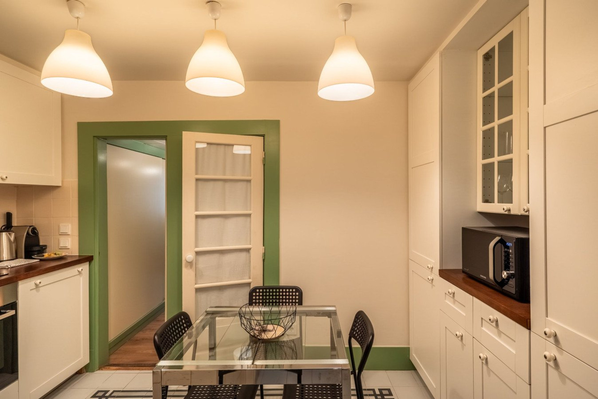 Kitchen with glass dining table