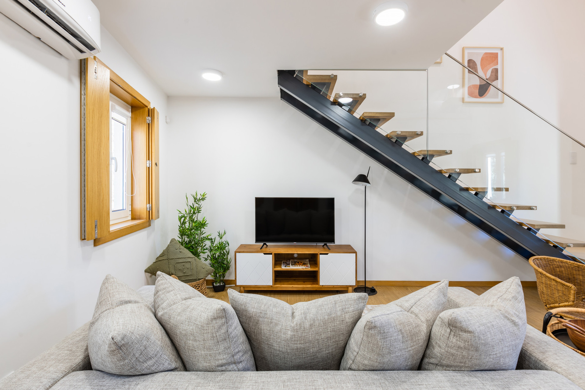 Living/Dining Area with Smart TV and Air Conditioning