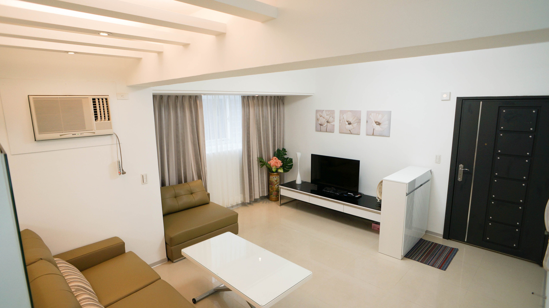 Bright living room with sofa TV