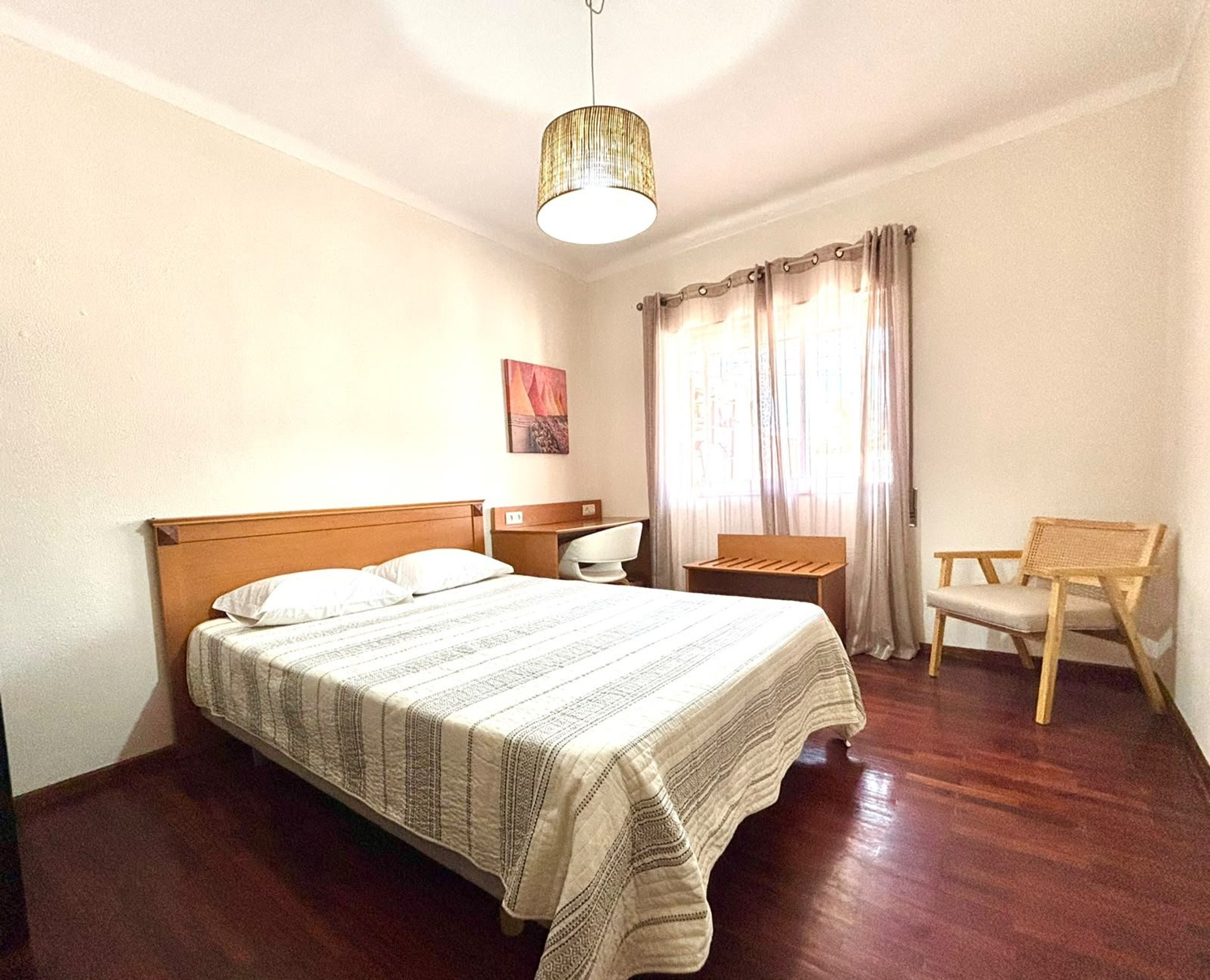 Bright bedroom with double bed