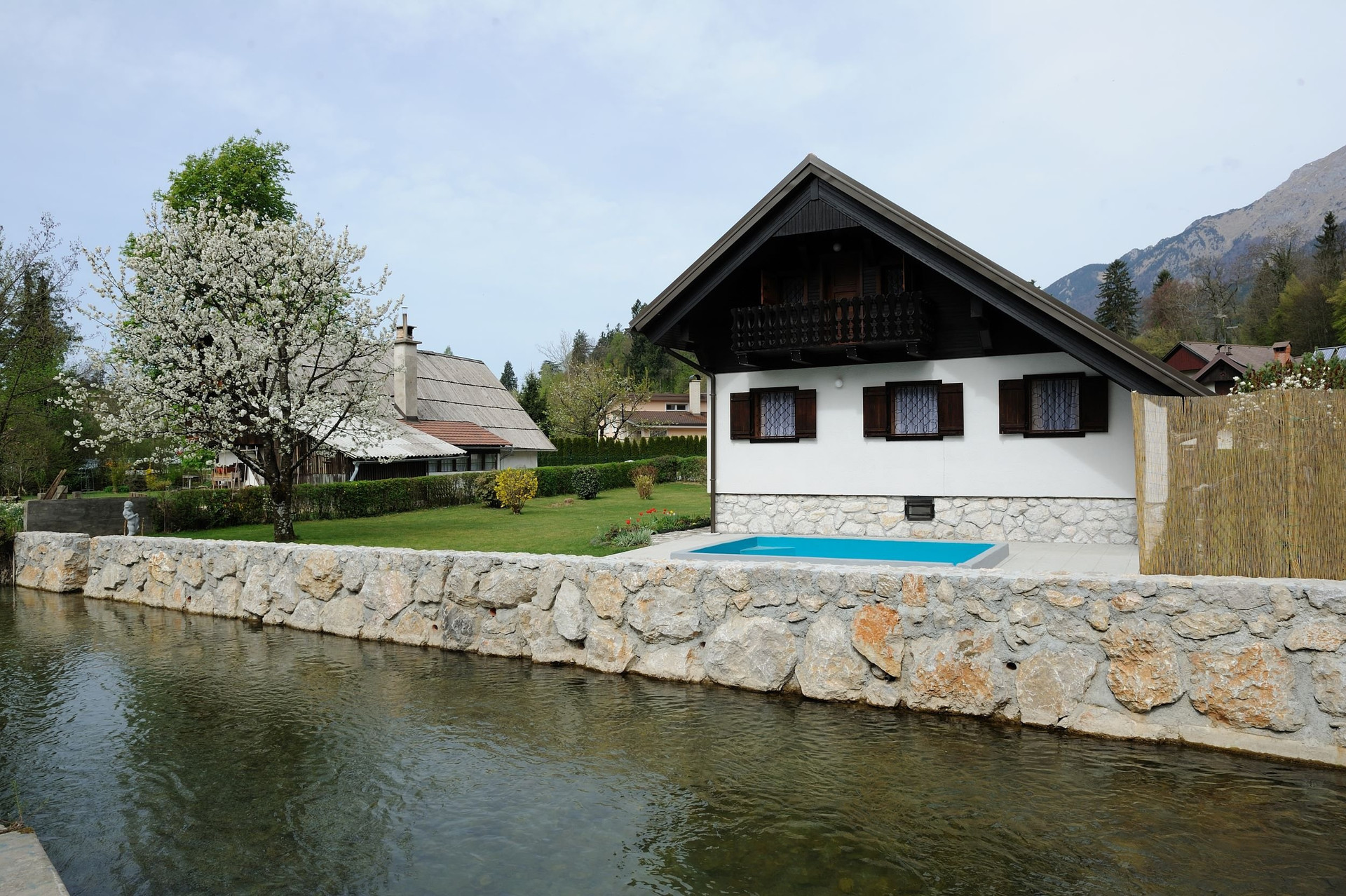 House by river mountain view