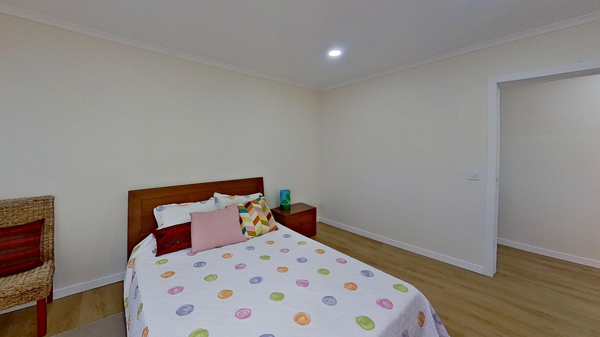 Bedroom with colorful bedspread