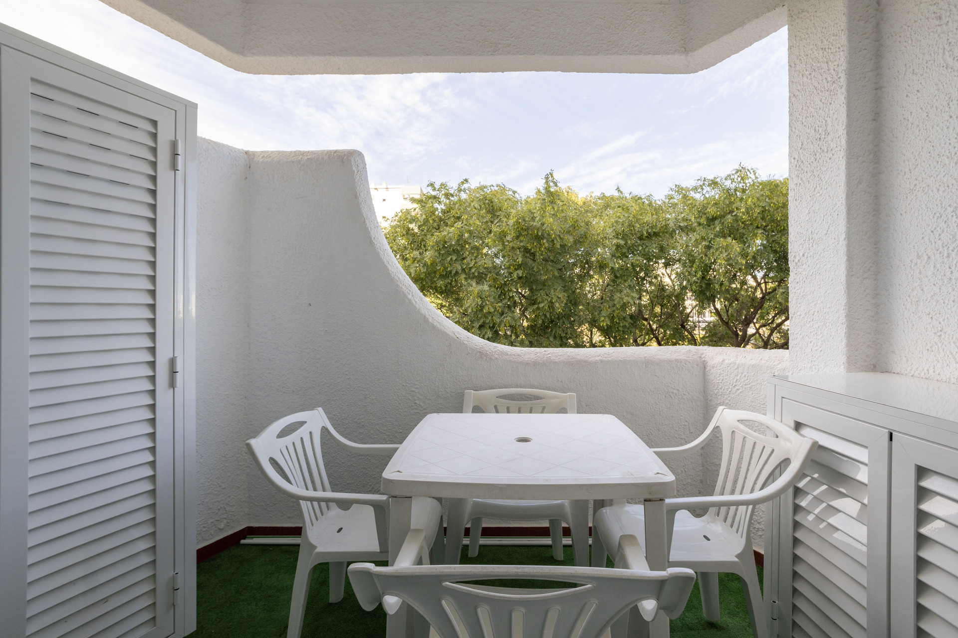 Bright balcony with outdoor seating