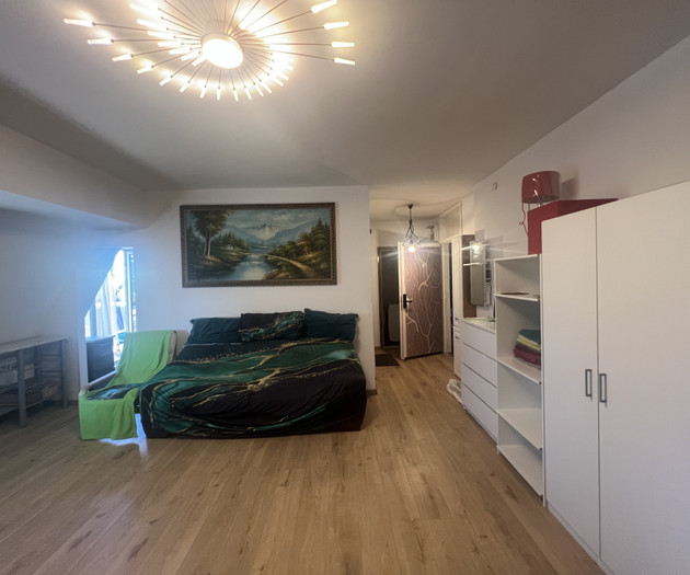 Bedroom with wardrobe and sofa bed