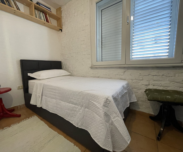 Single bed by window