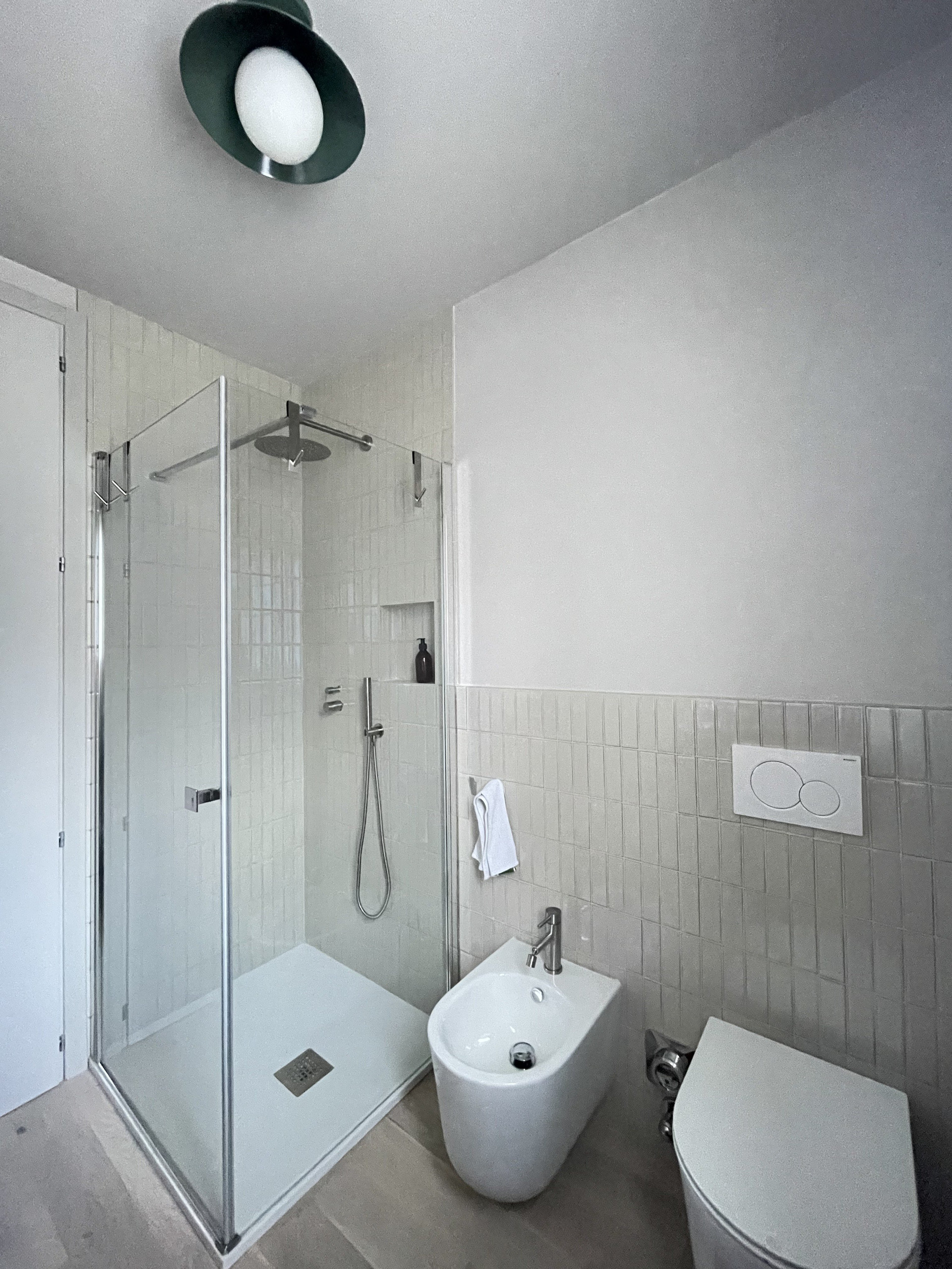 Bright bathroom with glass shower