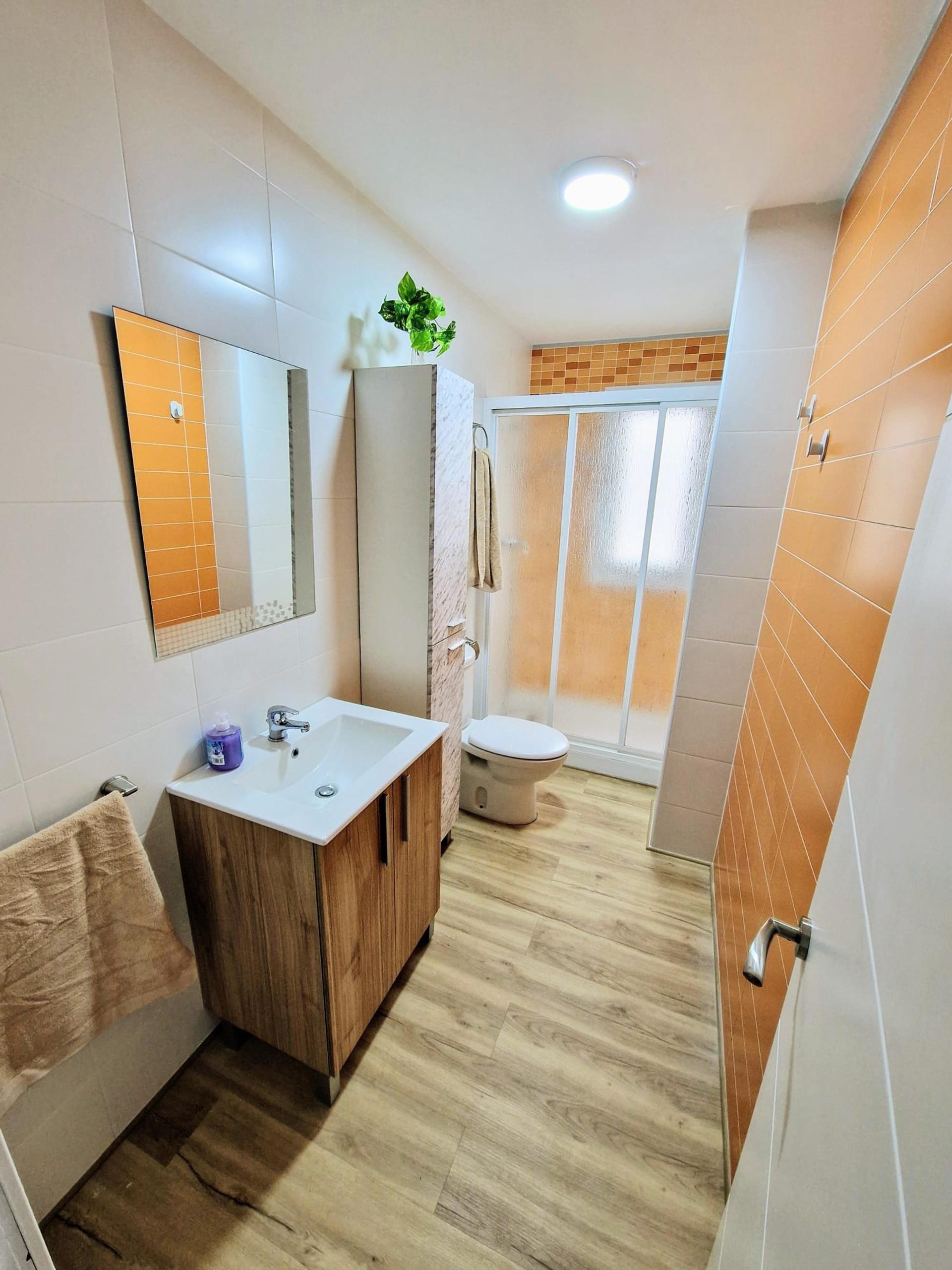 Bathroom with shower and sink