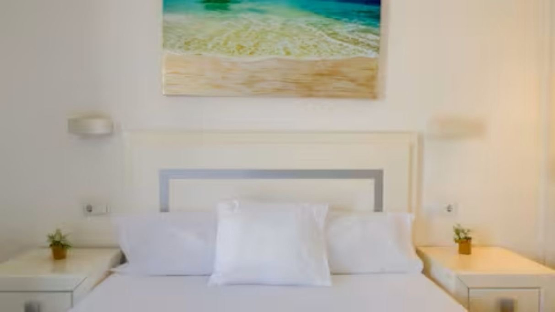 Bedroom with beach artwork
