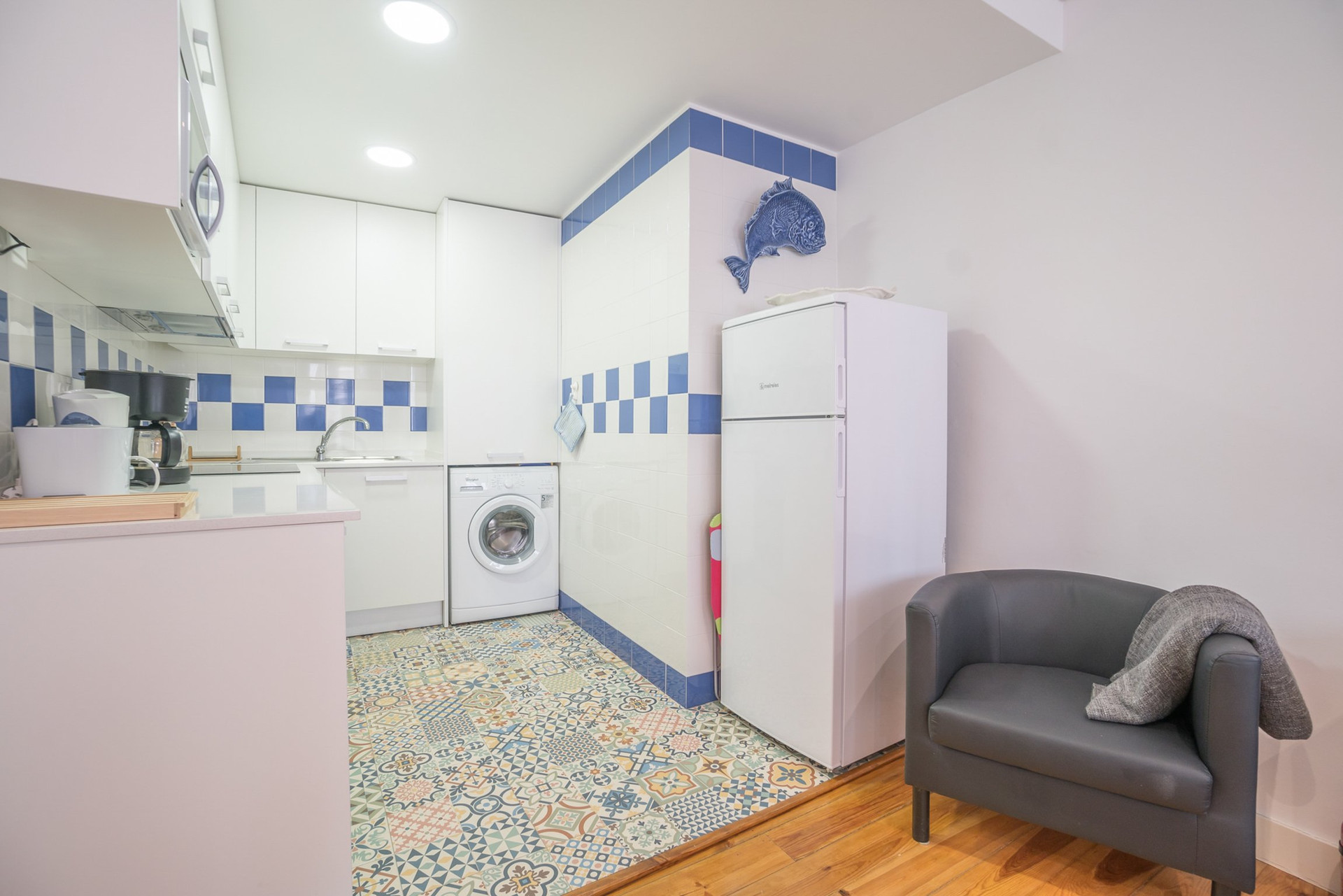 Kitchen with patterned tile floor