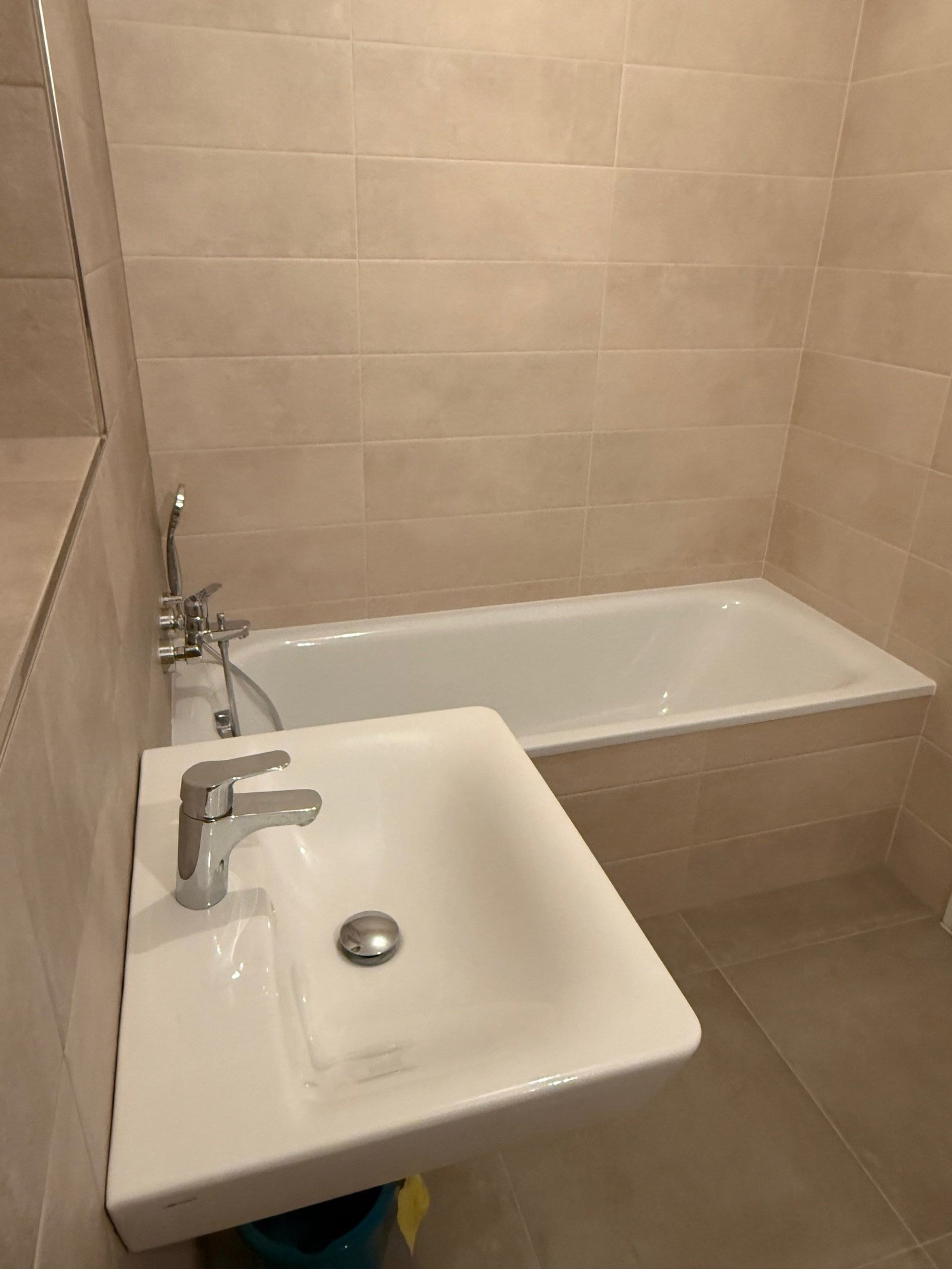 Bathroom sink and bathtub view