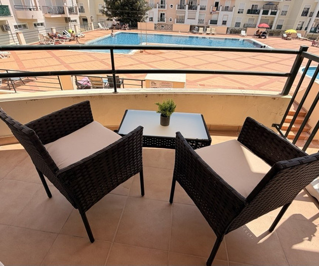 Balcony chairs overlooking pool area