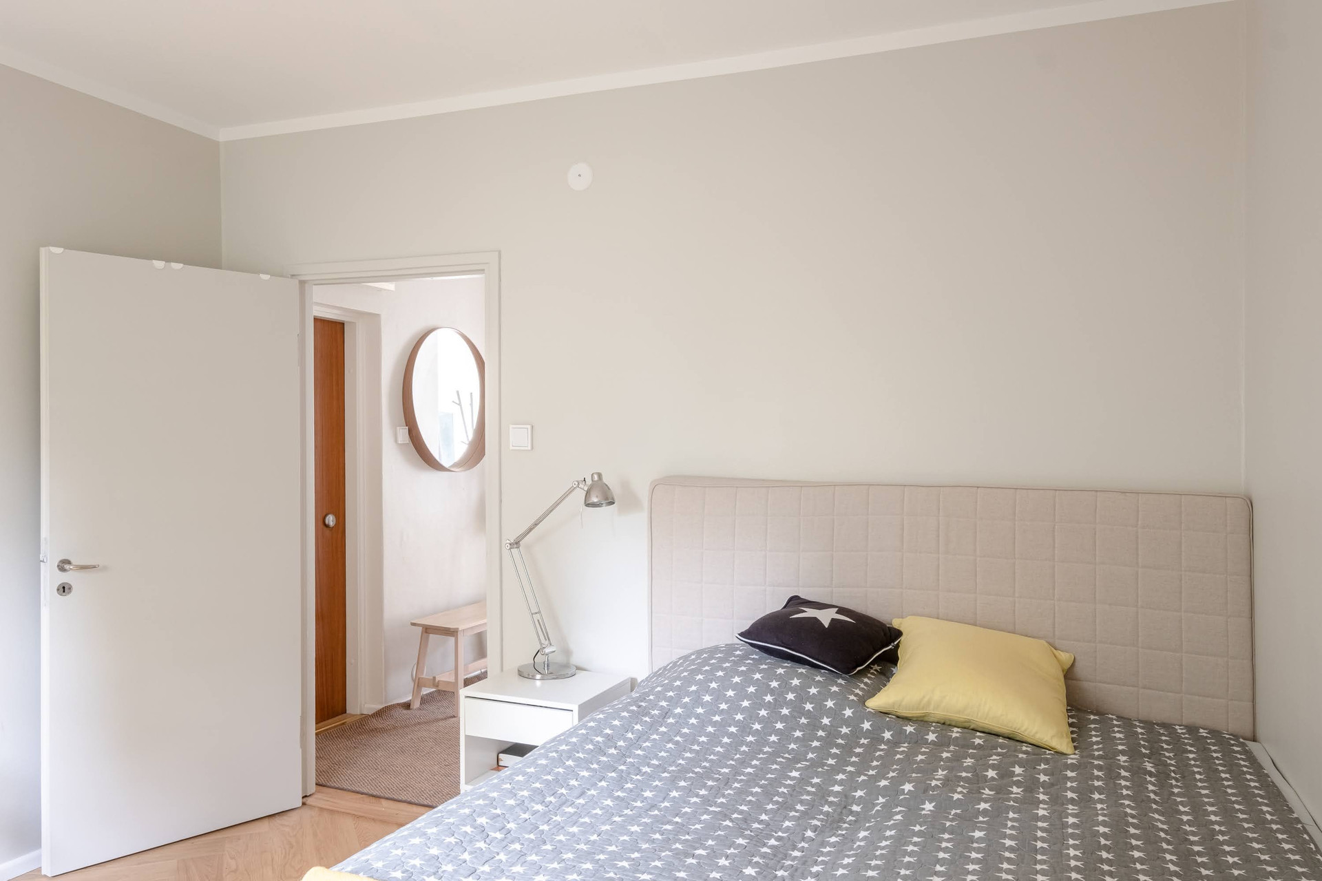 Bedroom view towards hallway mirror