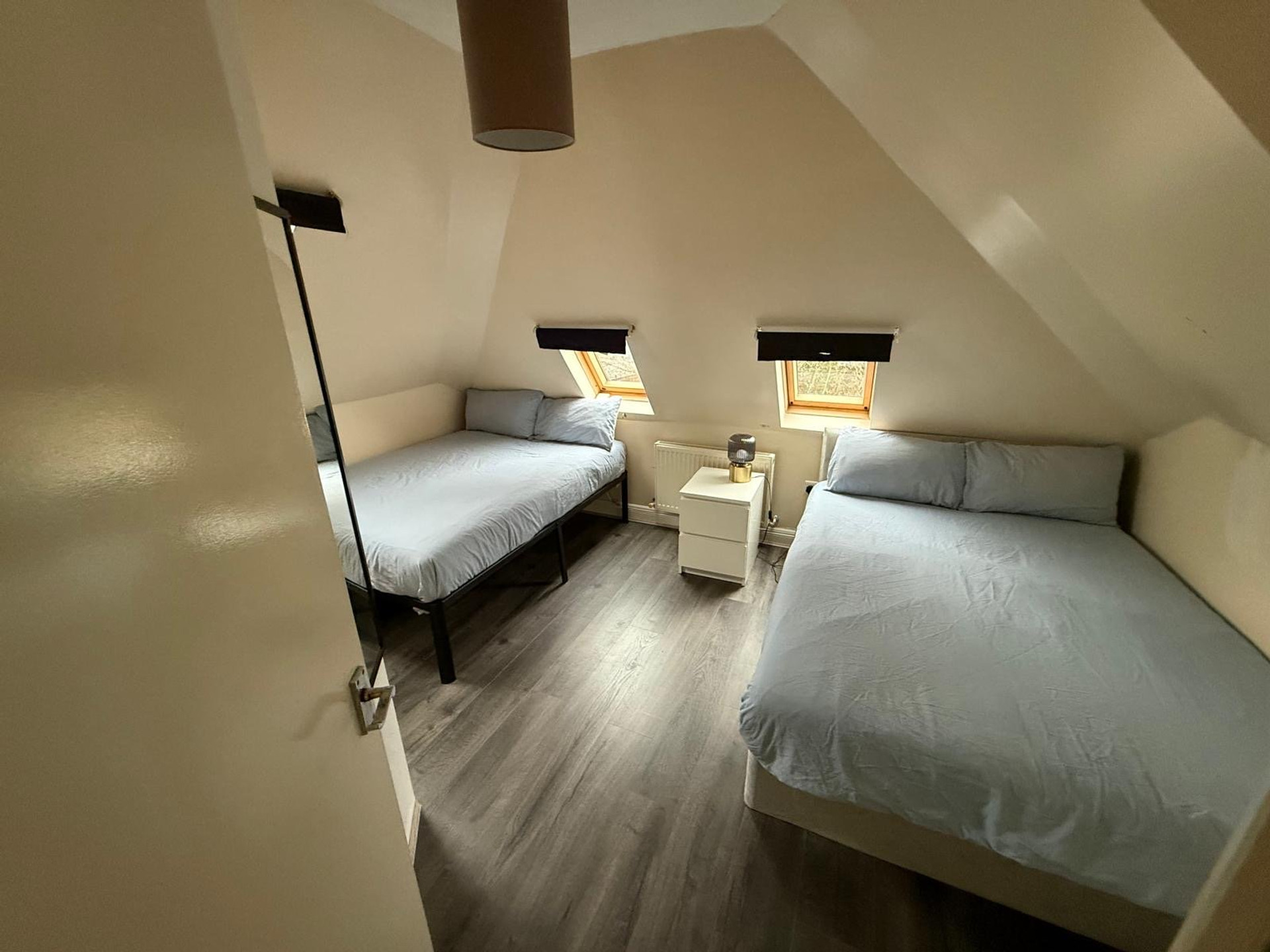 Twin bedroom with grey bedding
