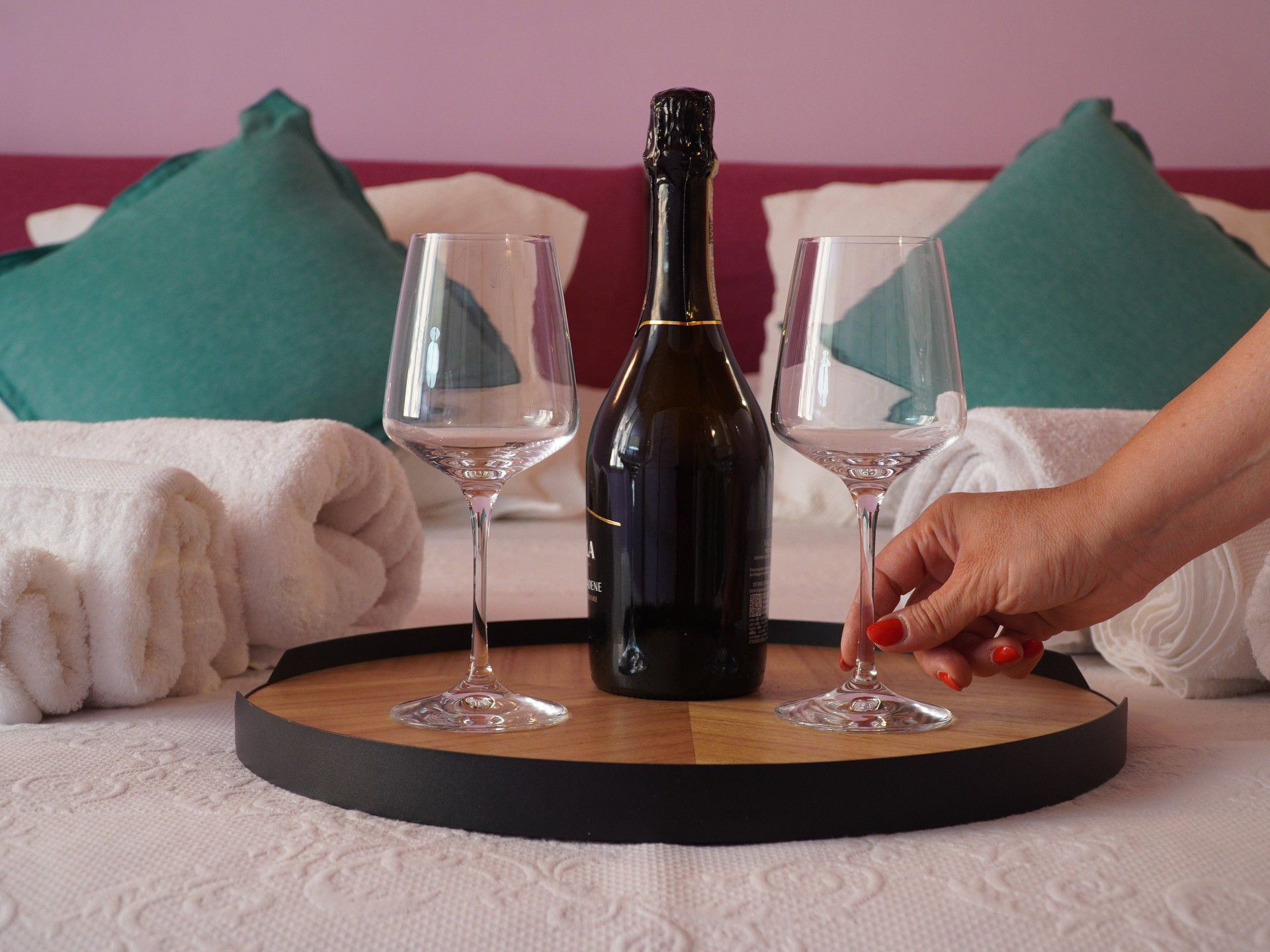 Champagne welcome tray on bed
