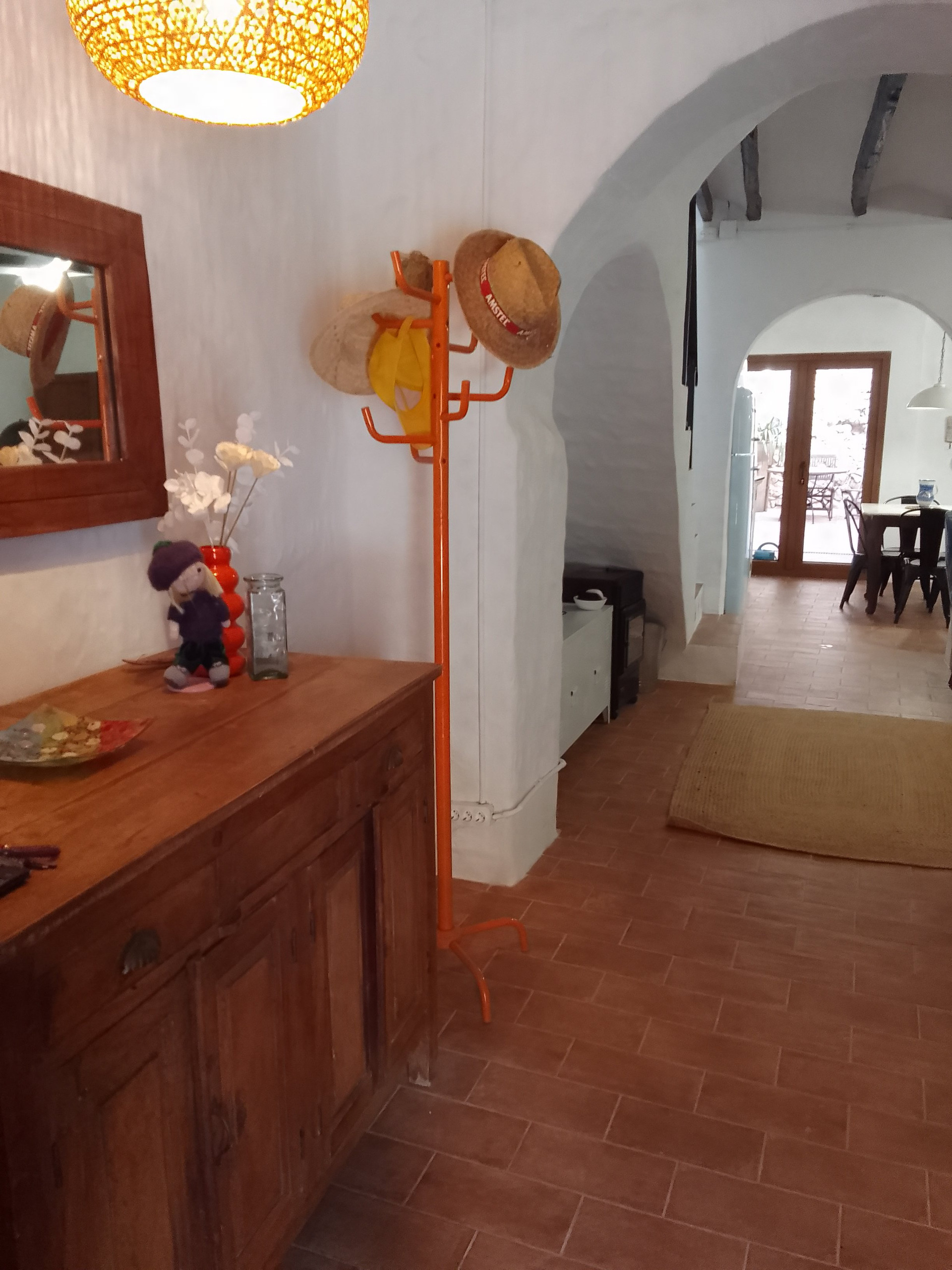 Hallway with coat rack arched ceiling