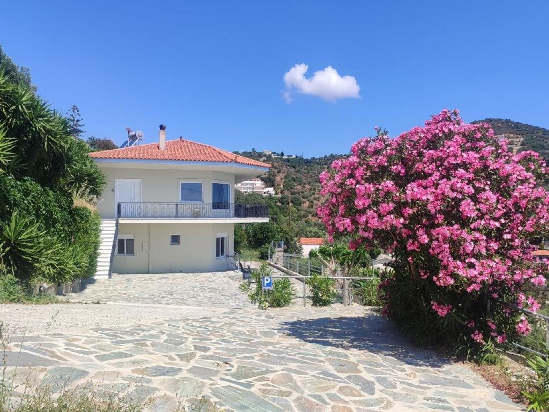 House exterior with pink flowers