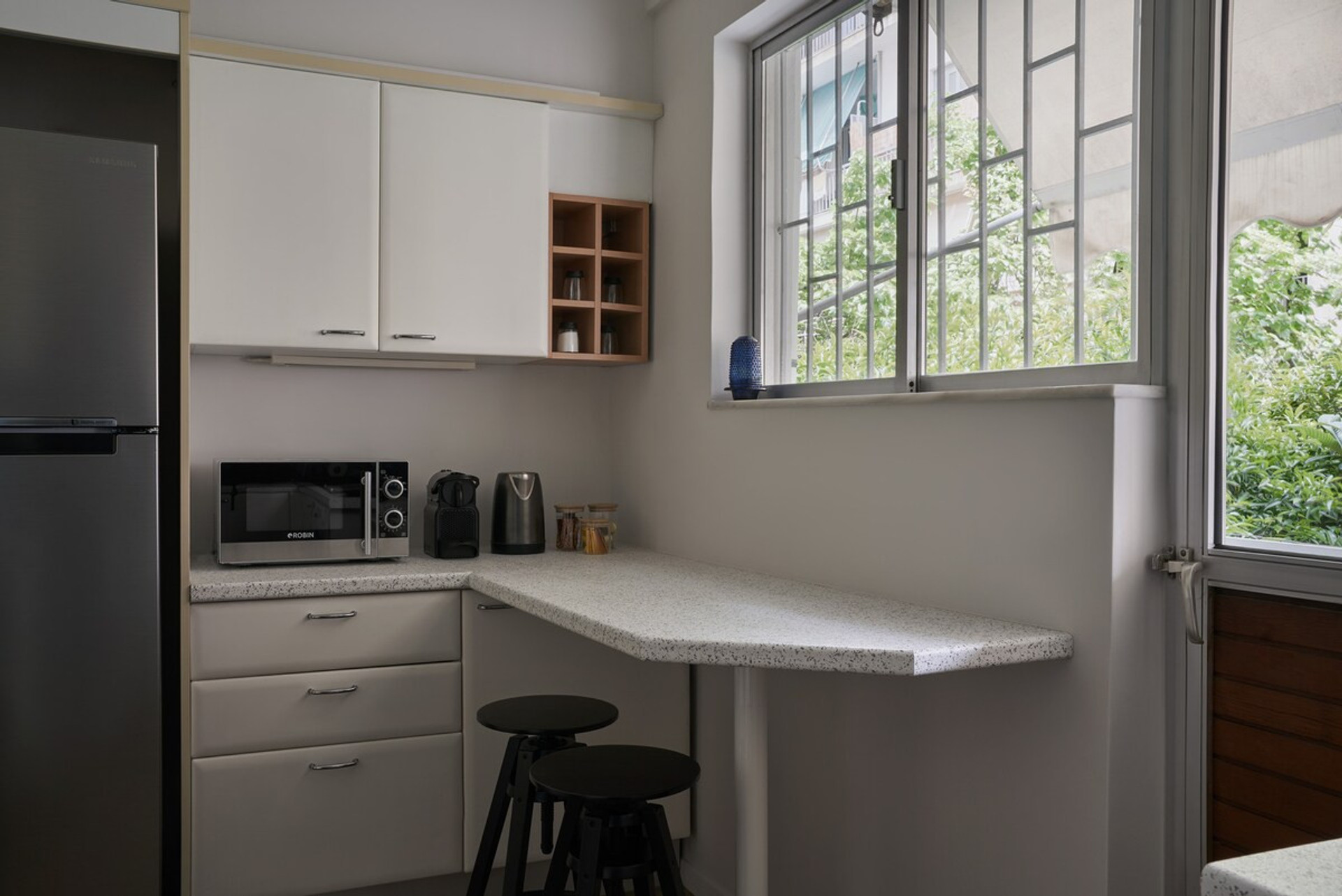 Kitchen space with a balcony at the back yard