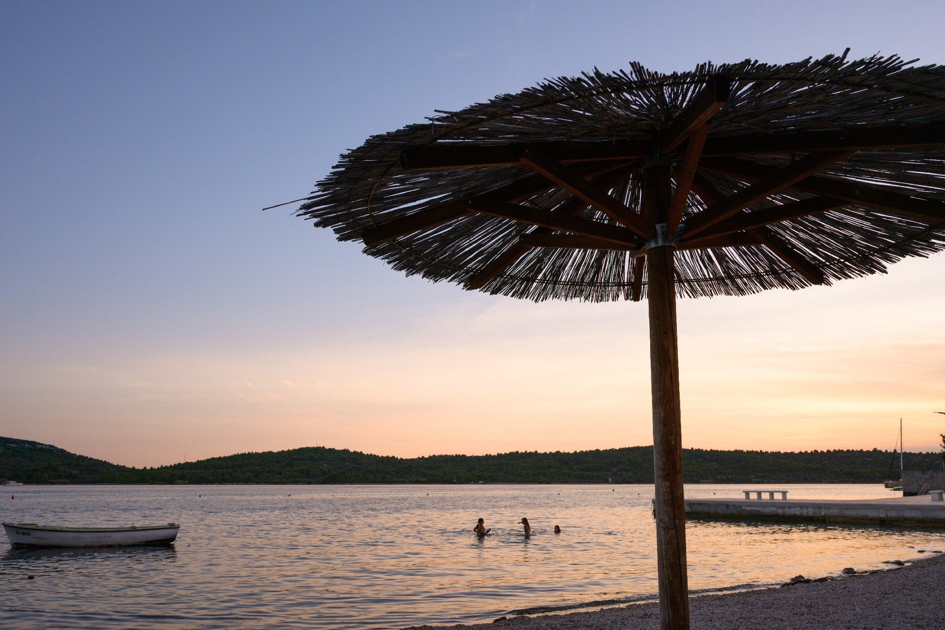 Sunset beach view with umbrella