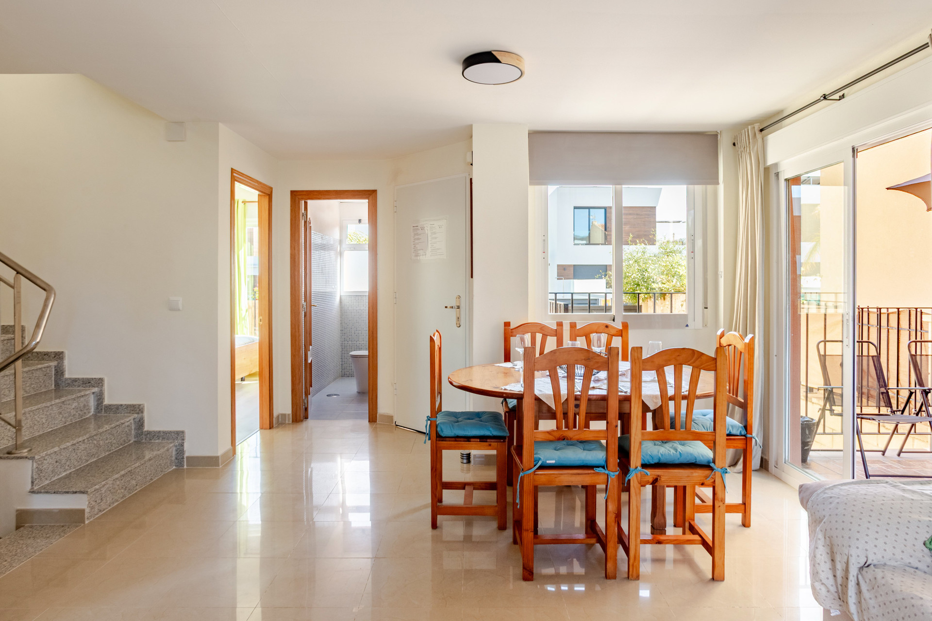 Dining area with staircase and terrace