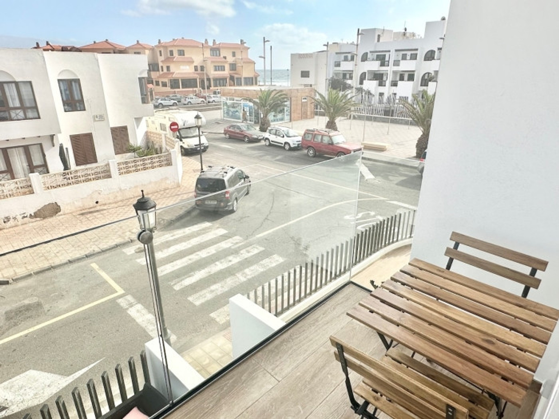 Balcony with street and sea view