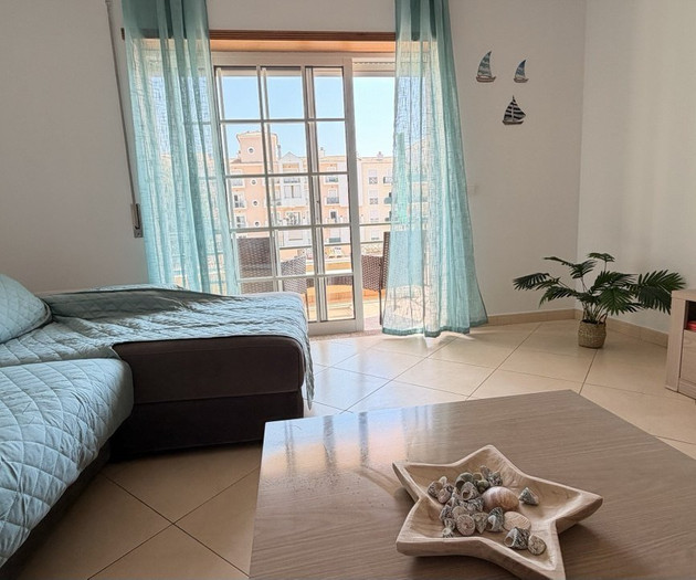 Living area with balcony city view