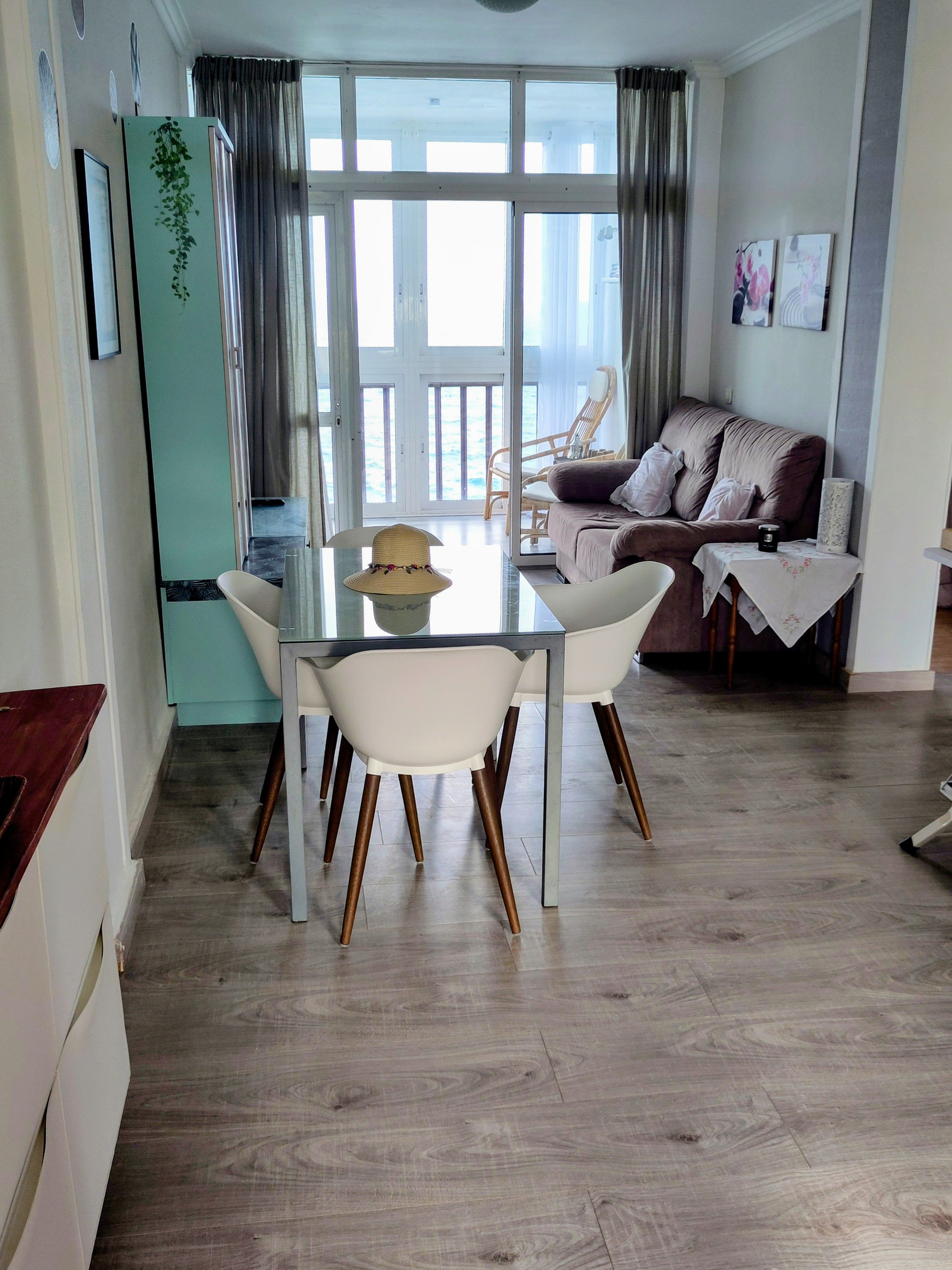 Living room with dining table sea view