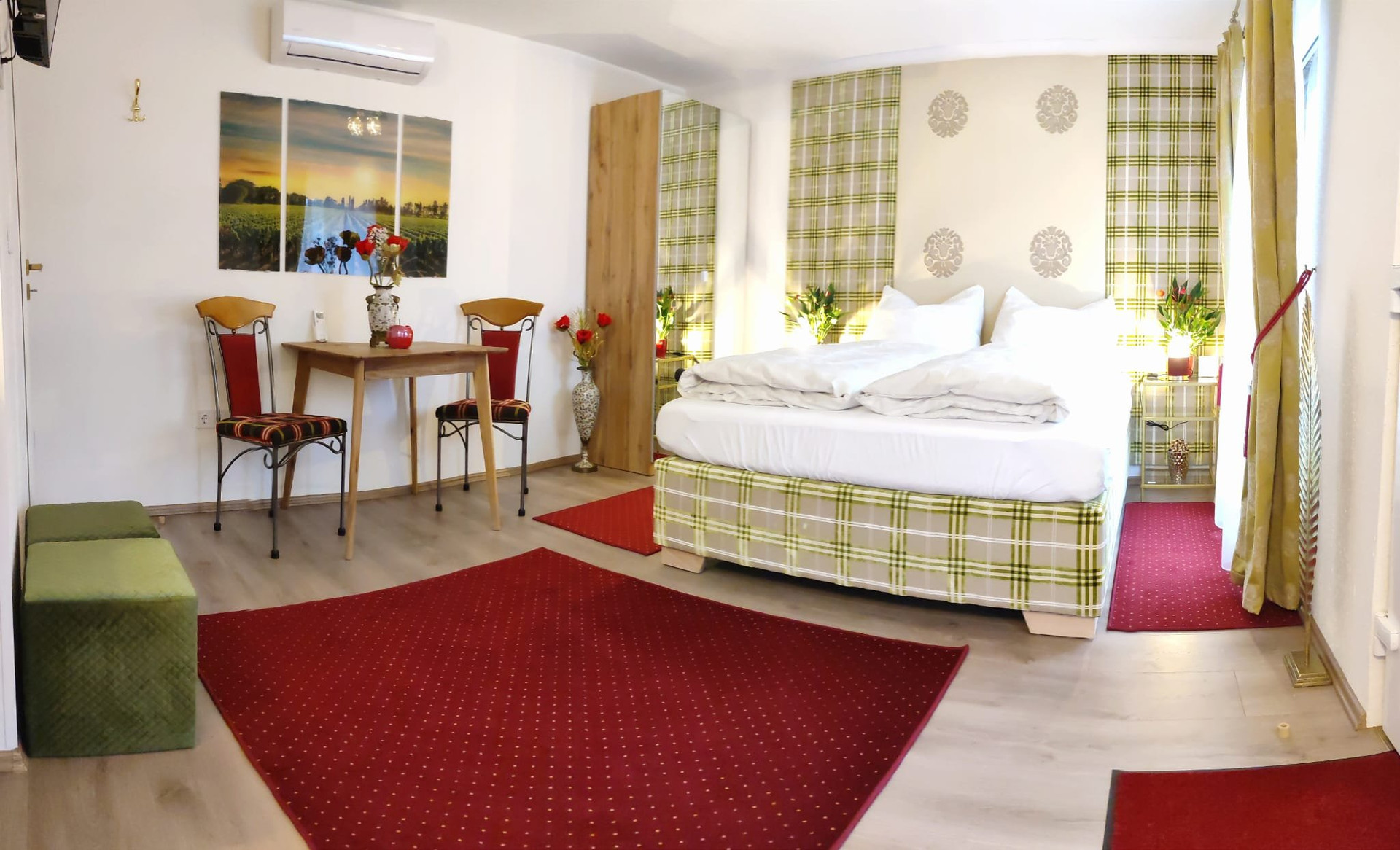 Bedroom with seating area and rugs