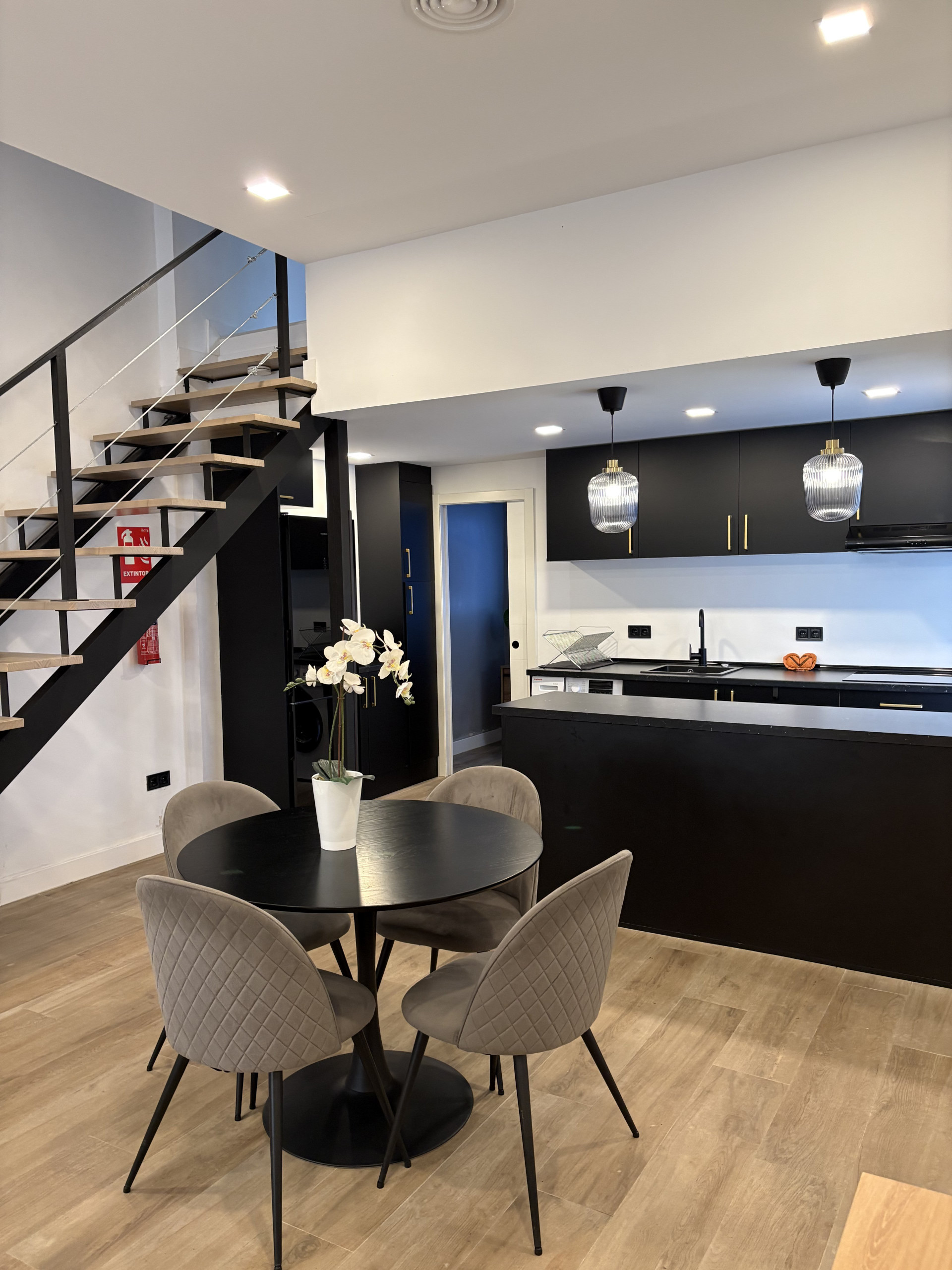 Dining area kitchen staircase overview