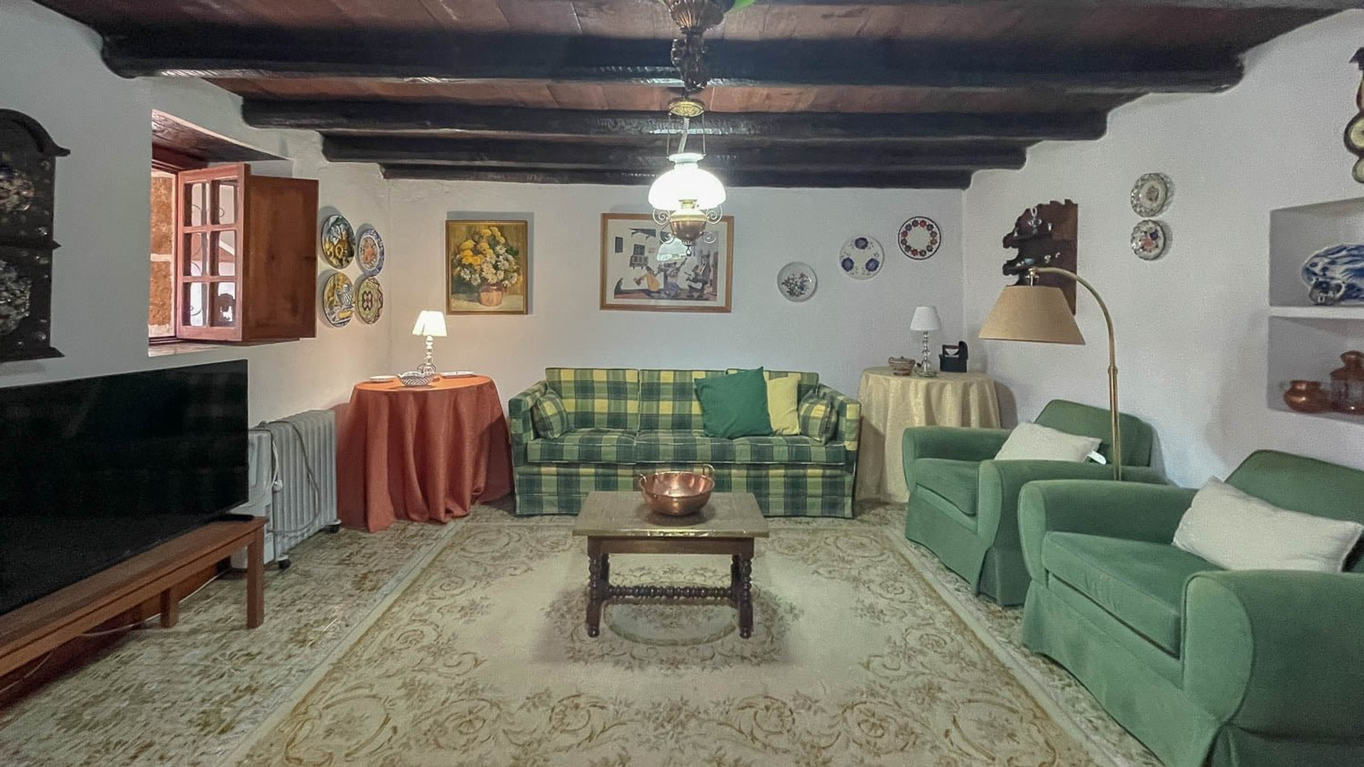 Living room with green sofas