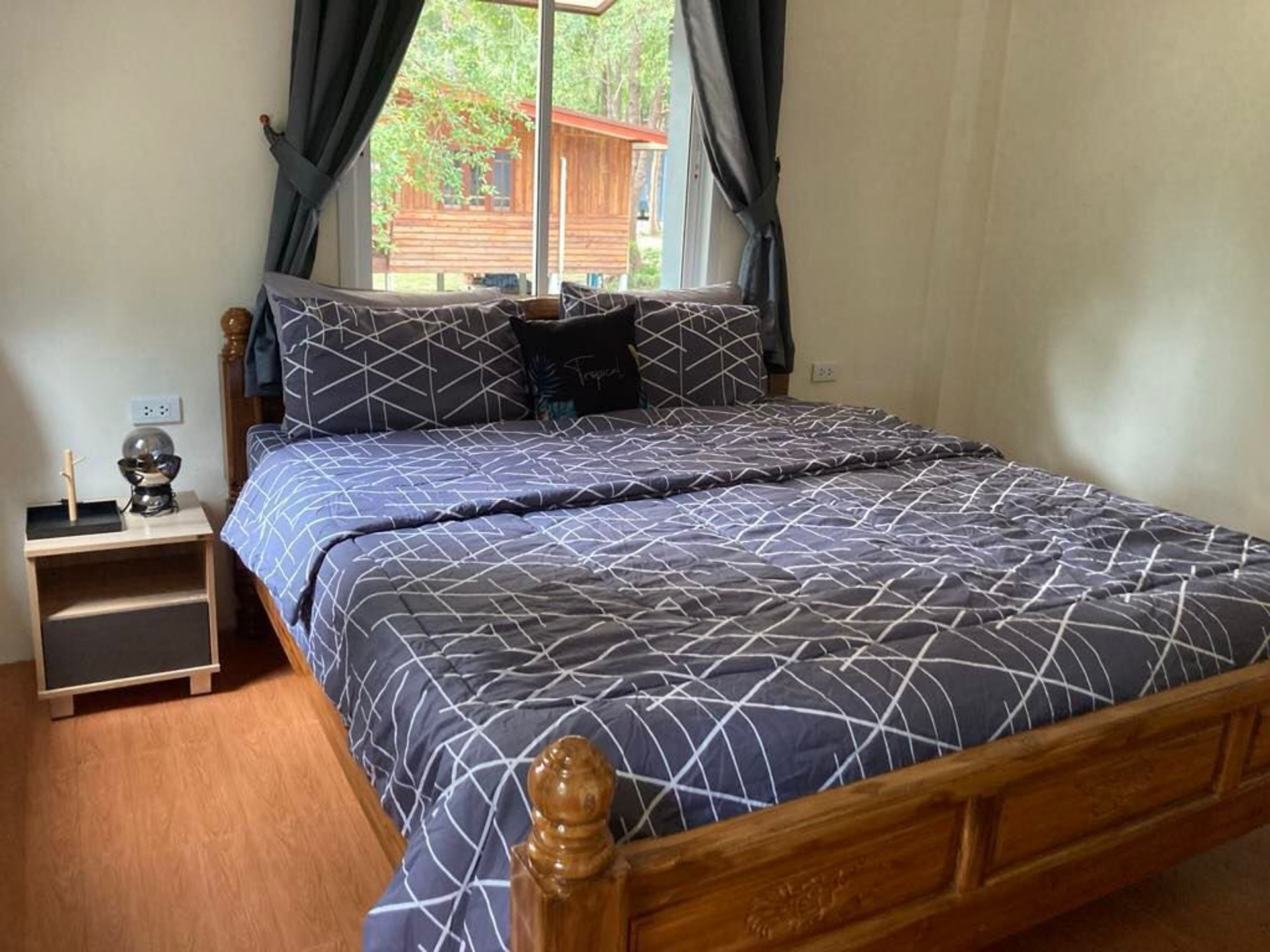Bedroom with wooden double bed