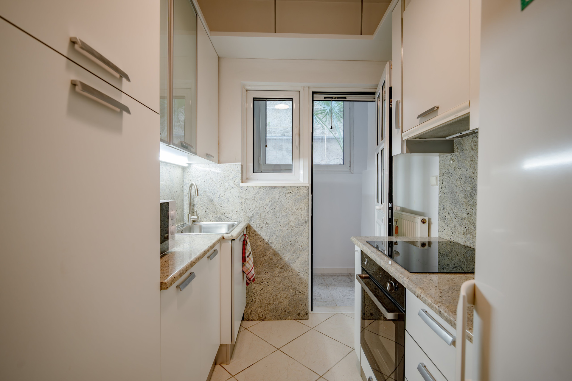 White kitchen with oven and plenty of cupboard space