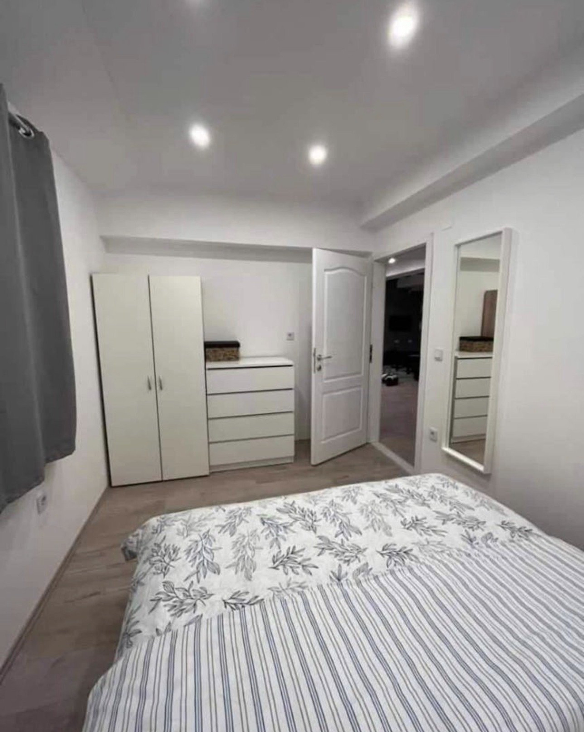Bedroom with wardrobe and mirror