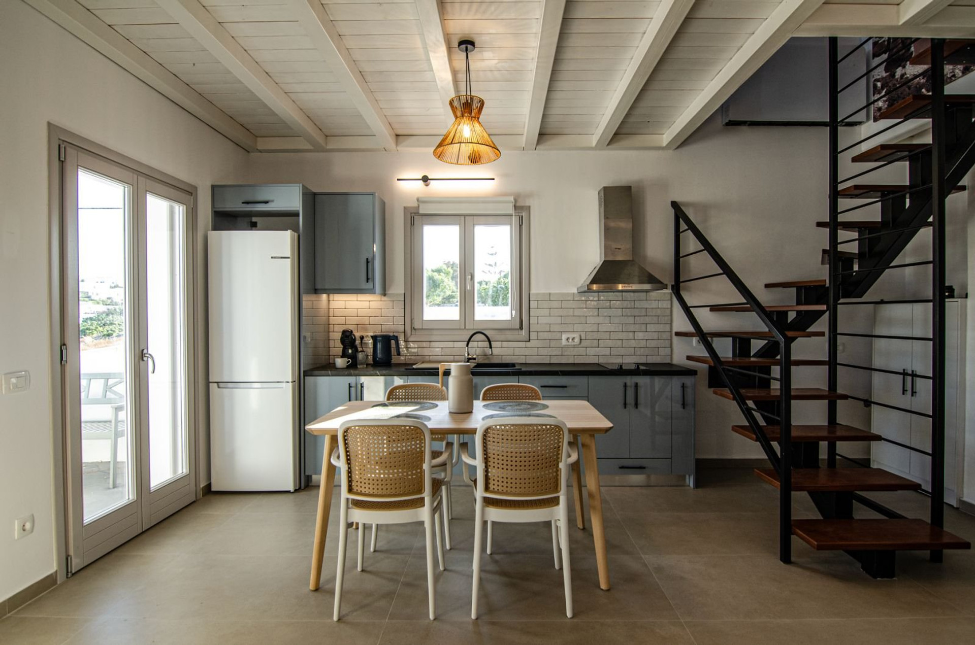 Kitchen with dining table and stairs