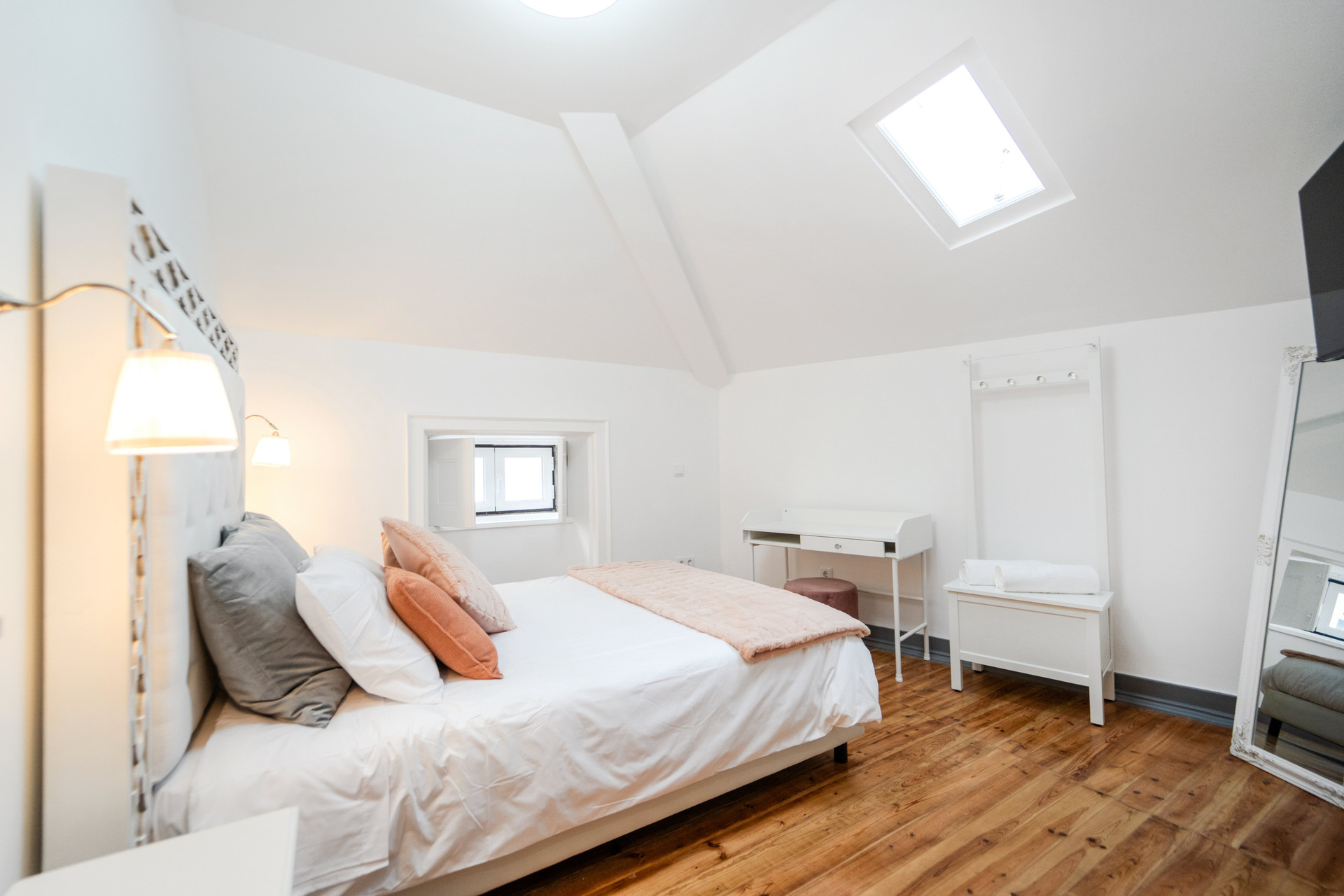 Bright bedroom with skylight and desk