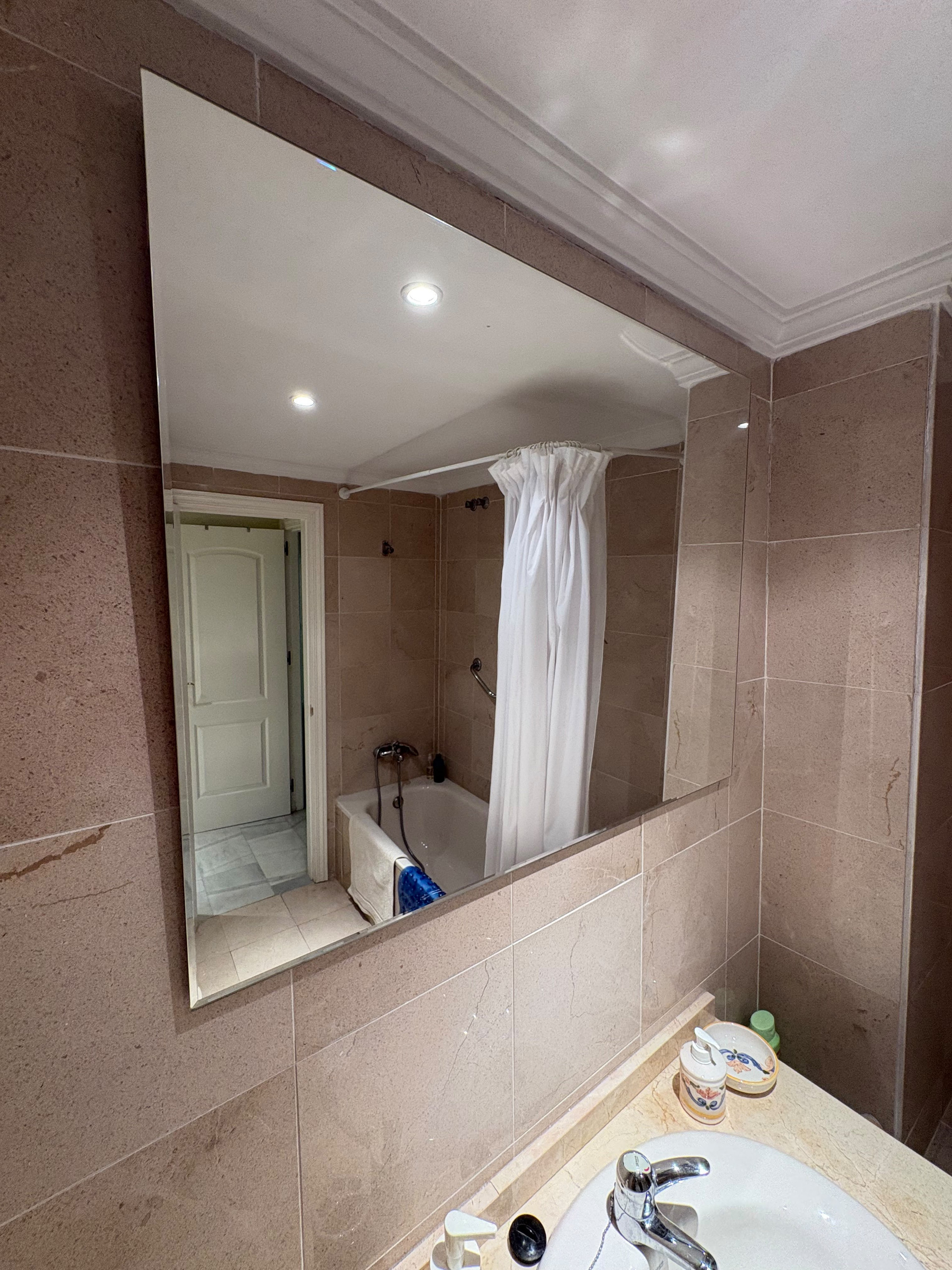 Bathroom mirror with tub view