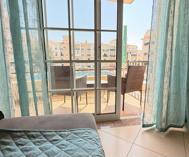 Bedroom balcony overlooking pool