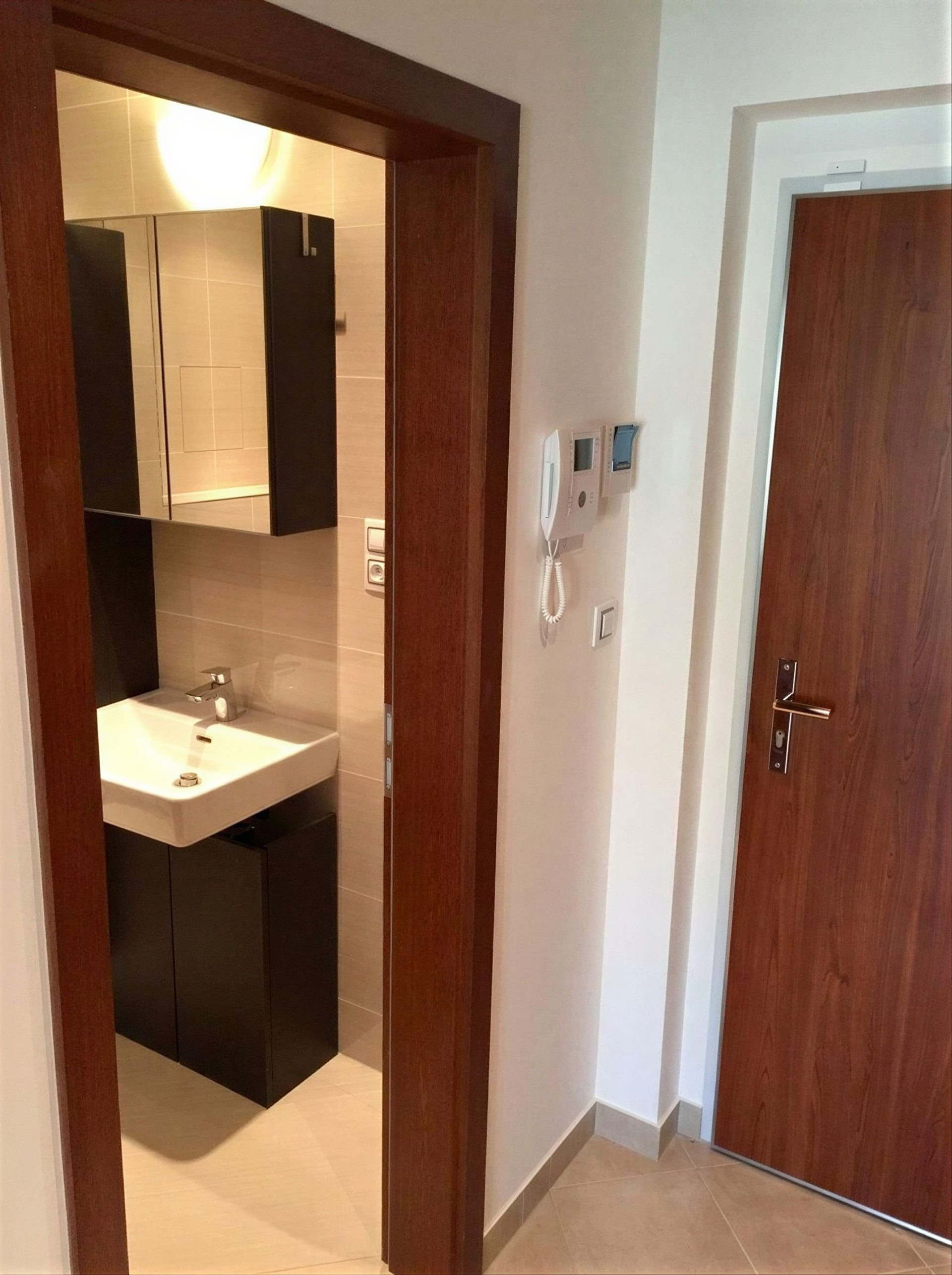 Entryway with bathroom and front door