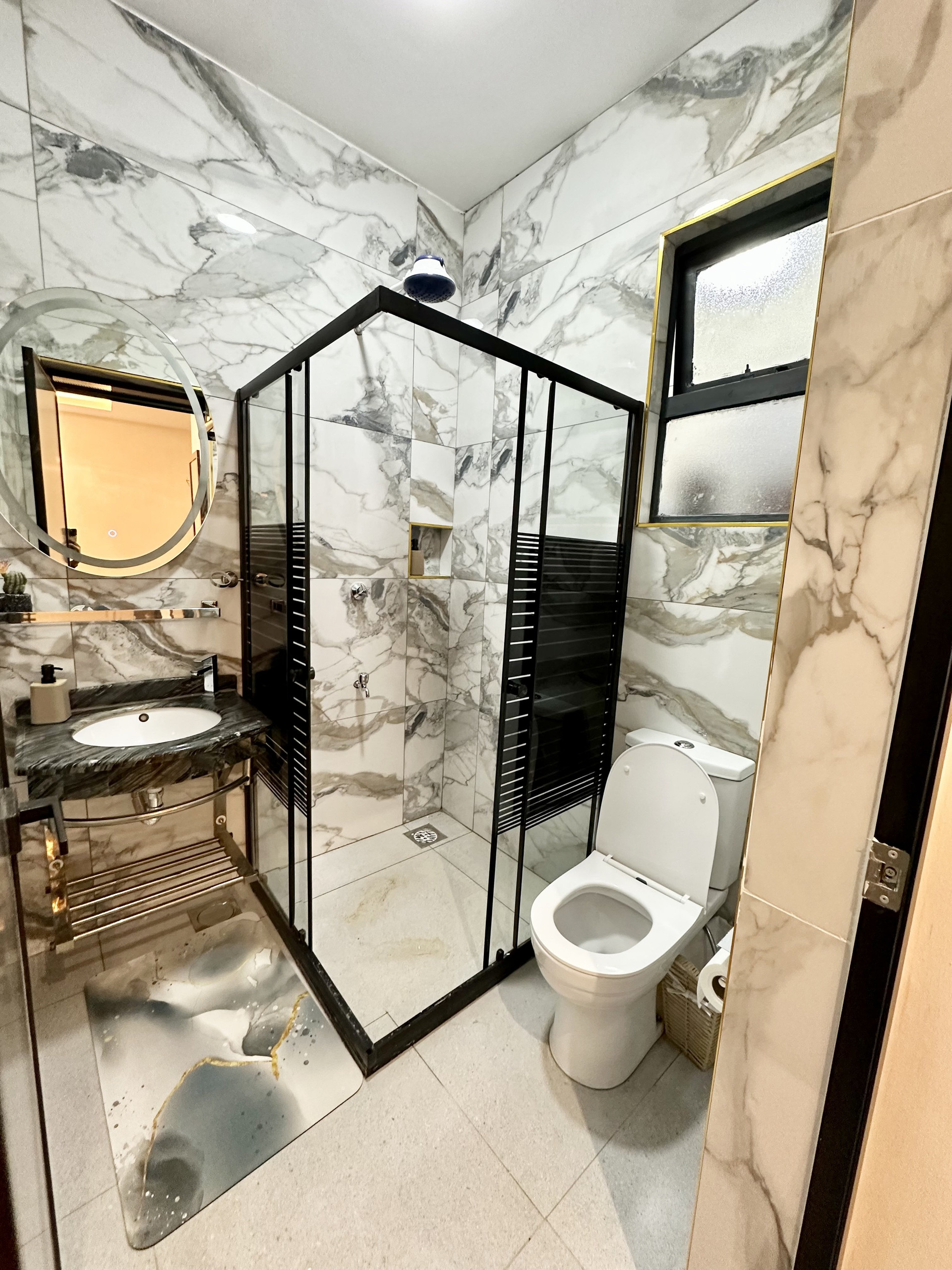 Marble bathroom with glass shower