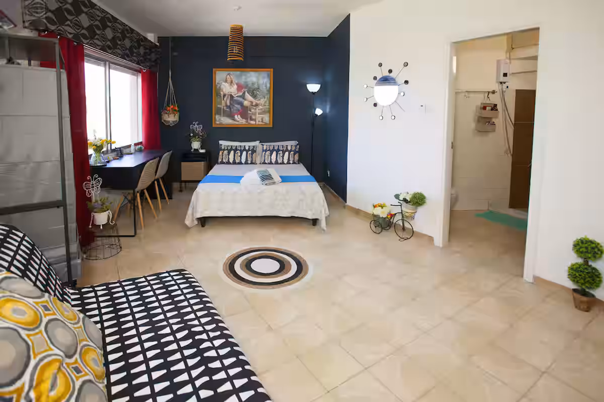 Open studio with bed and sofa