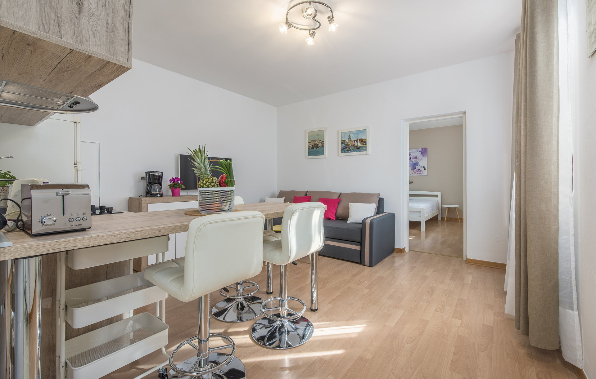 Living area with kitchen bar stools