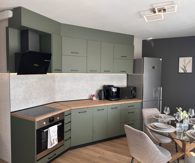 Kitchen with fridge and table