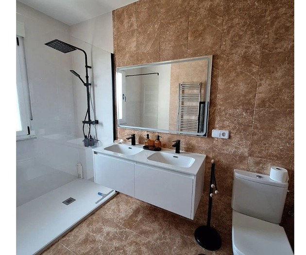 Bathroom sinks and toilet