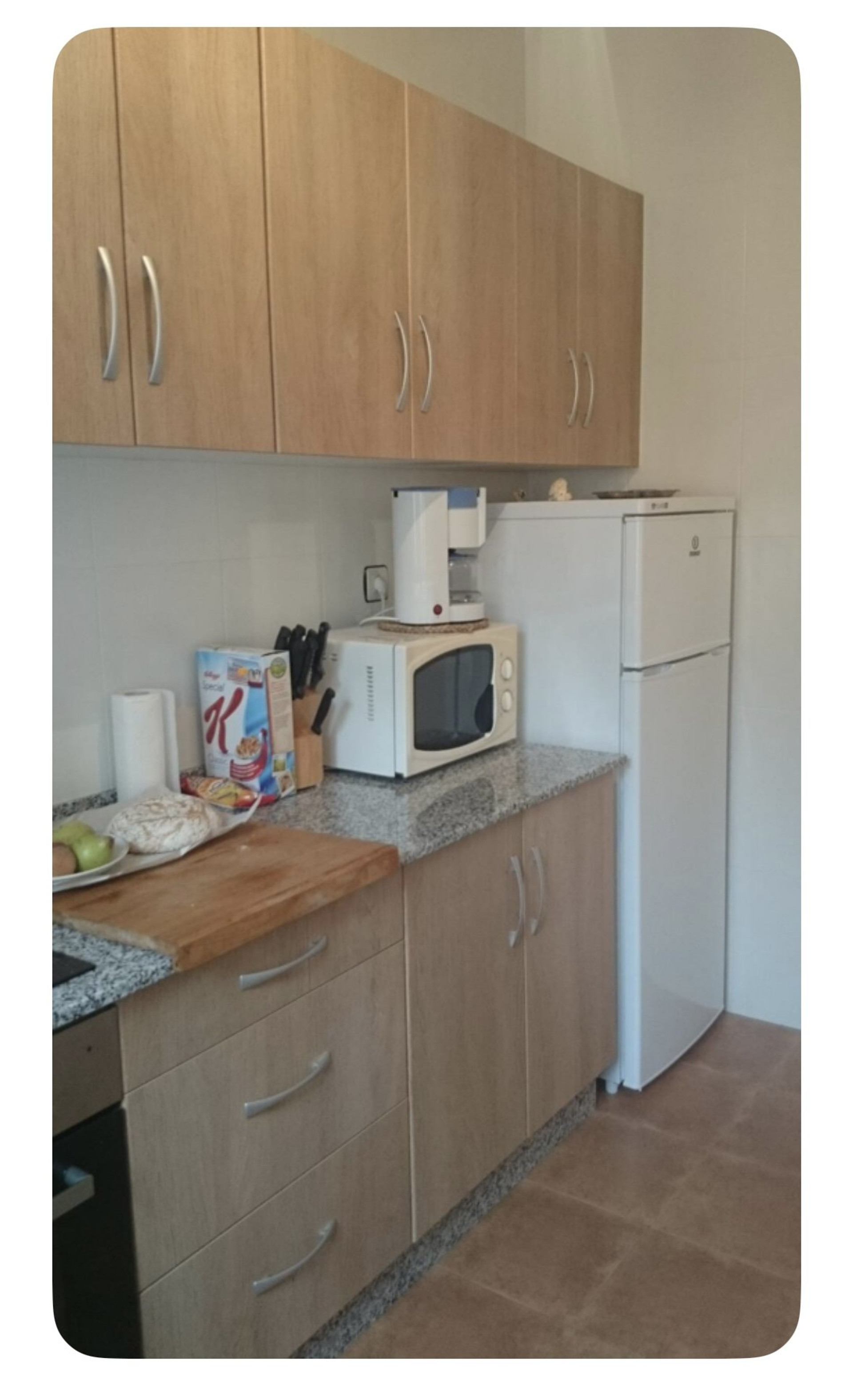 Kitchen with fridge and microwave
