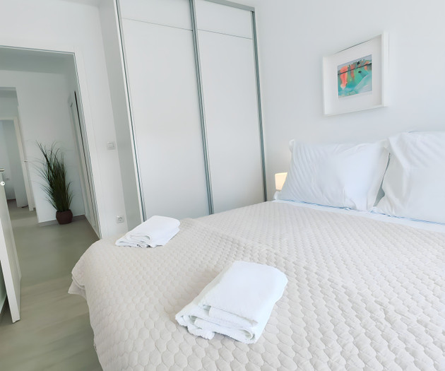 Bedroom with wardrobe and hallway view
