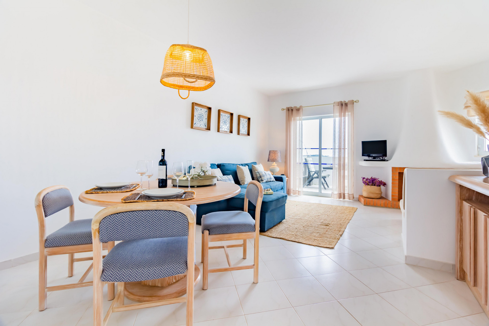 Living Room with Flat-Screen TV, Sofa and Balcony