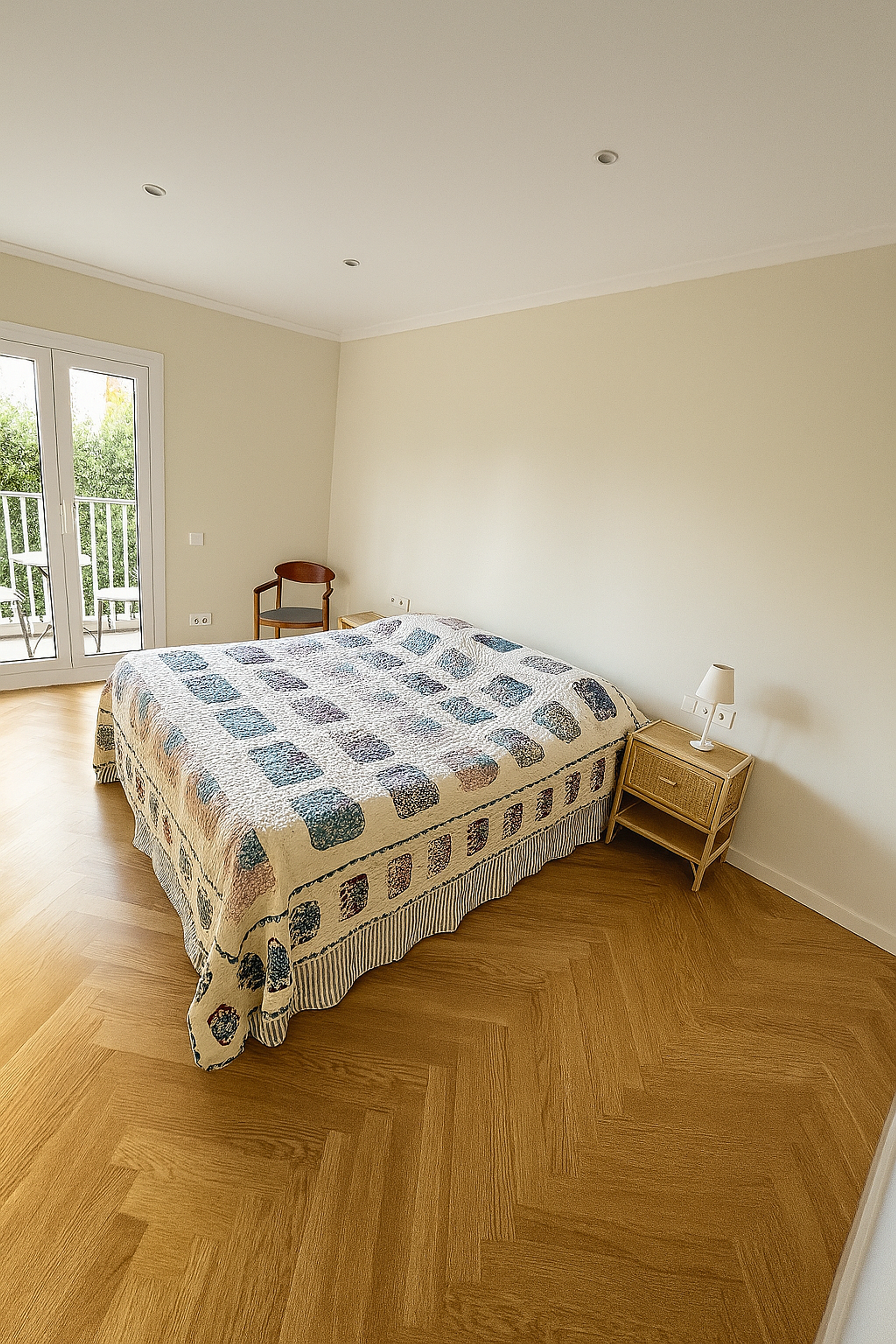 Spacious bedroom with balcony access