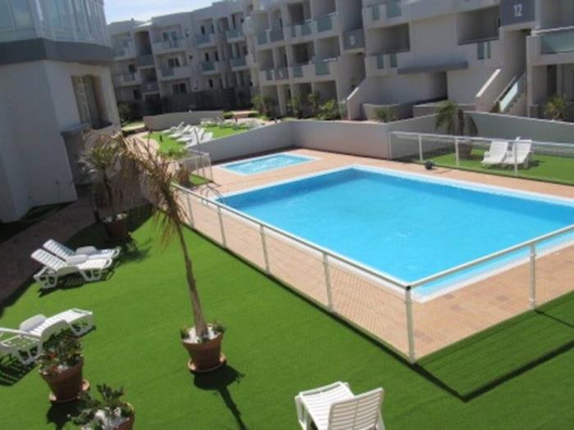 Shared pool with sun loungers